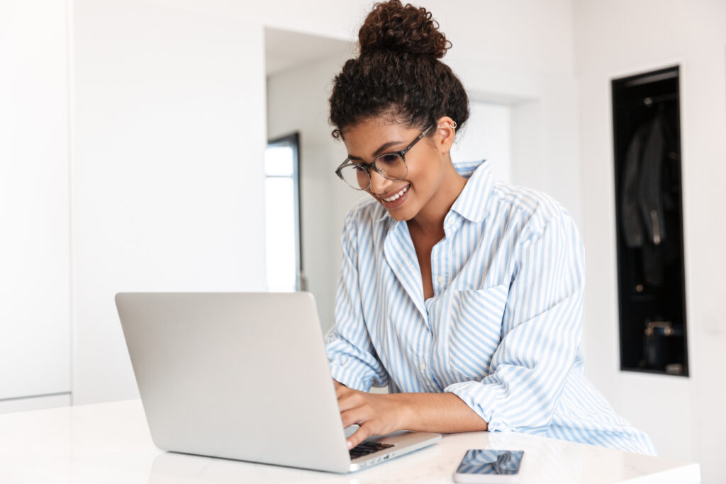 women sitting at a computer updating her payment info